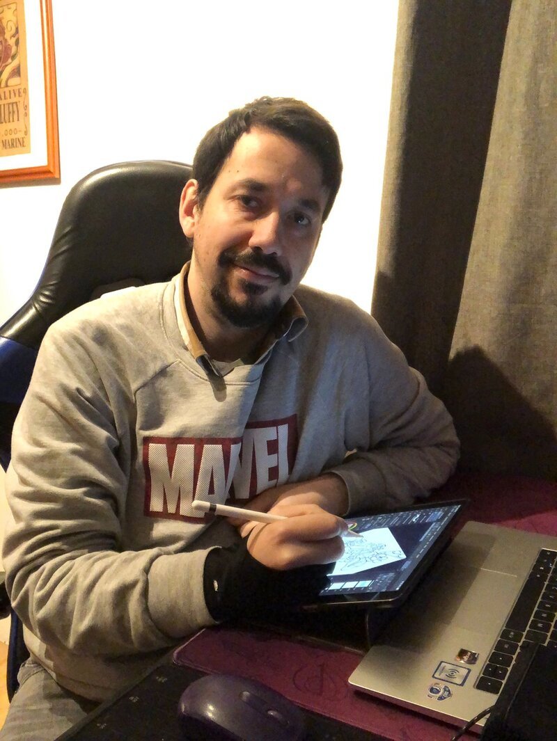 Portrait of Pedro Leon, Chilean illustrator and comic book author, working on a digital drawing tablet
